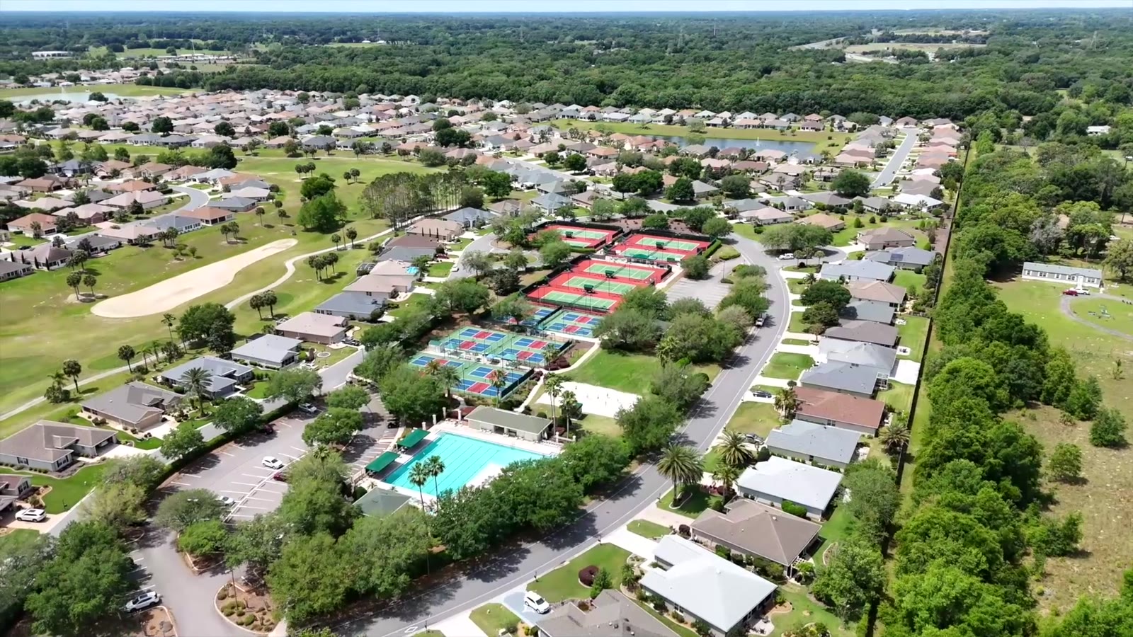 Aerial view of single-family homes and streets at Del Webb Spruce Creek