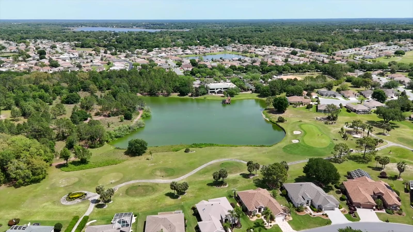 Community lake and golf at Del Webb Spruce Creek